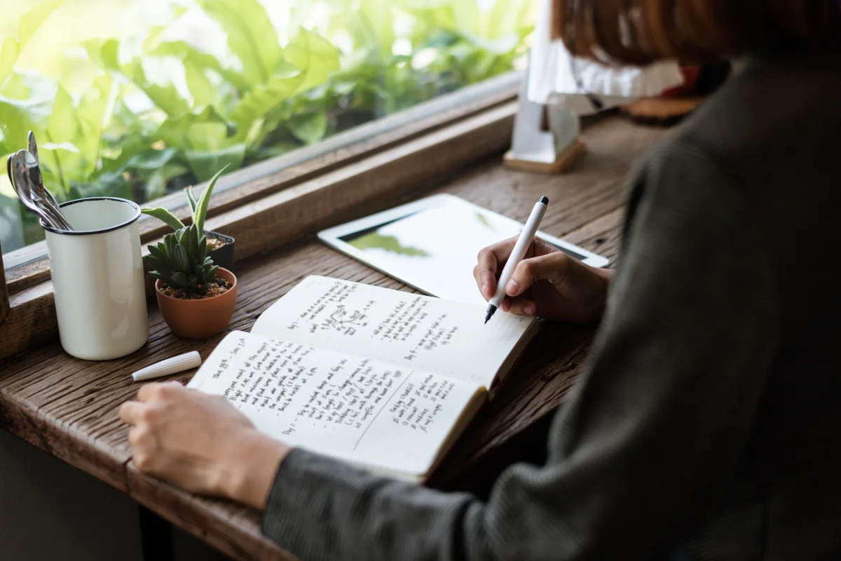closeup-girl-writing-her-journal