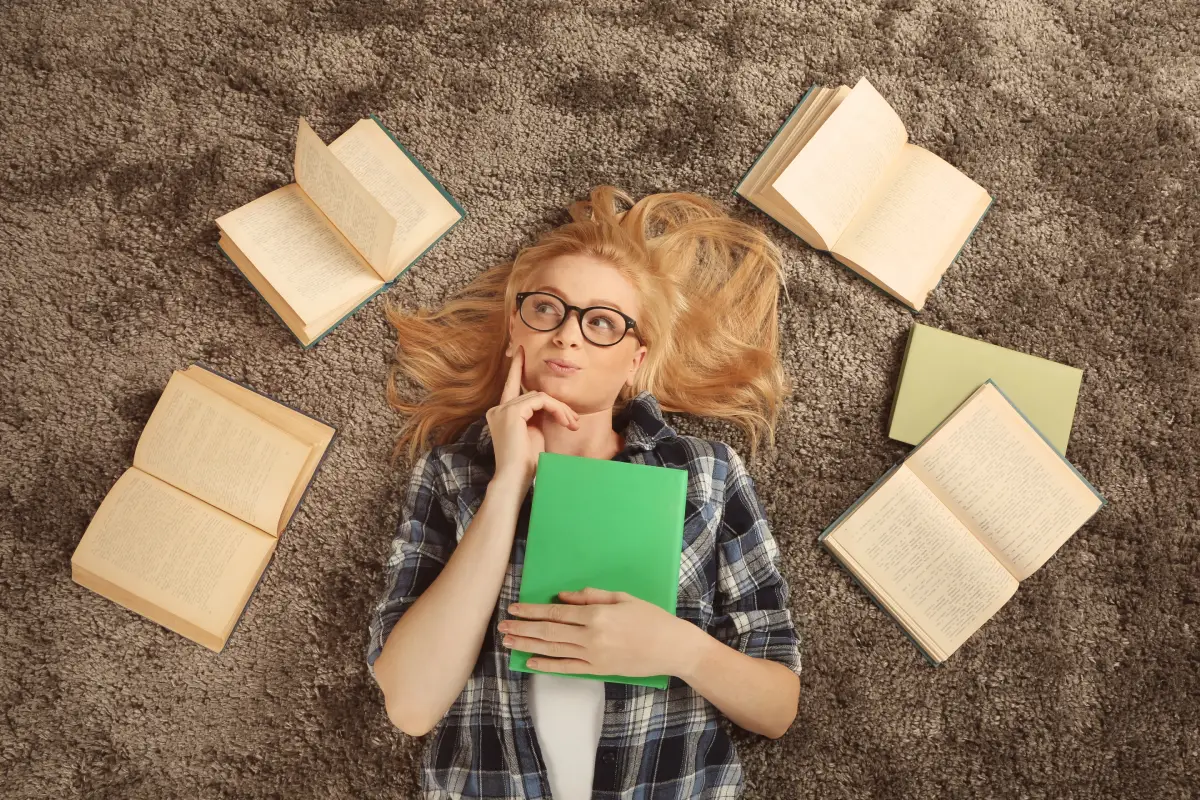 beautiful-girl-with-books-lying-floor-vv1